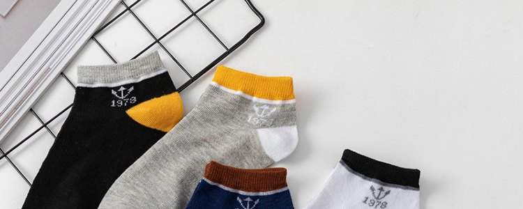Ankle socks laid out flat, showing cuffs, heels and toe seams
