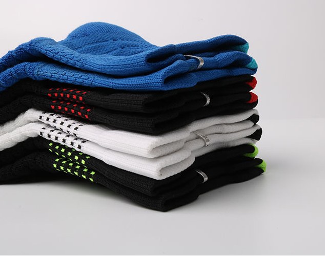 Folded grip socks showing coloured silicone dots on the soles